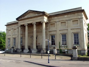 Photograph of the front of Swansea museum on a sunny day.
