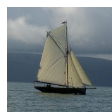 The pilot cutter Olga in full sail at sea.