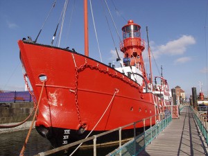 Photograph of the red Helwick lightship moored on a pontoon.